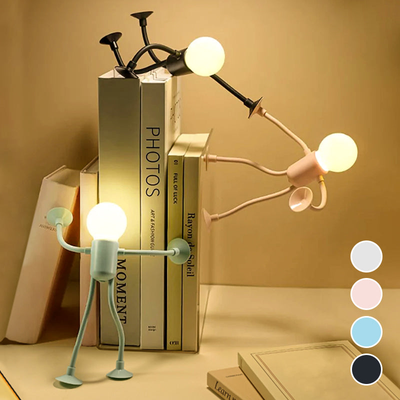 Trois veilleuses allumées contre une pile de livres, dont une poussant les livres, avec pastilles des quatre coloris disponibles. 5
