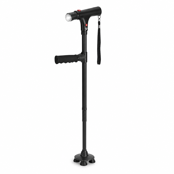 Canne noire vue de face sur fond blanc, avec poignée en T, lampe, dragonne et base à quatre pieds 1