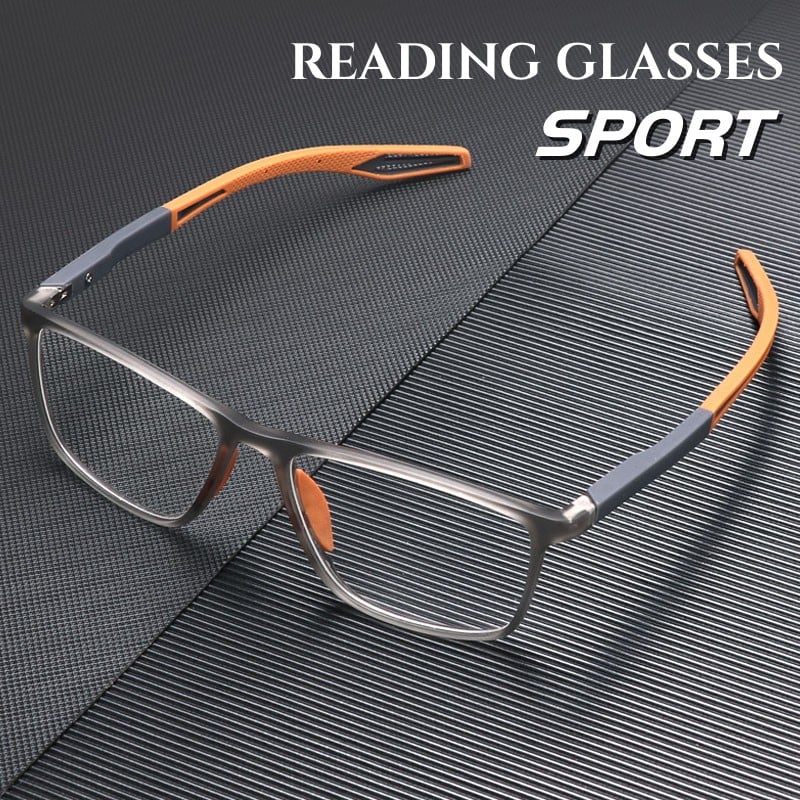 Lunettes à monture rectangulaire grise translucide et branches sport orange et grises, posées sur une surface texturée sombre. 1