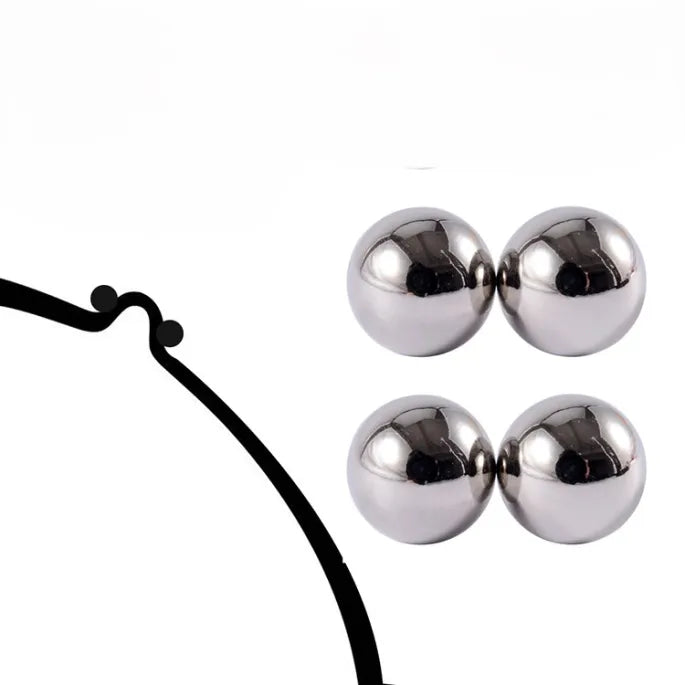 Deux paires de billes magnÊtiques en mÊtal argentÊ brillant sur fond blanc, avec un schÊma noir d'un petit support courbe. 6