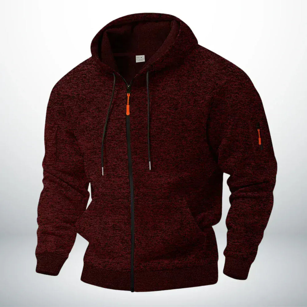 Même sweat zippé à capuche en chiné bordeaux foncé, vu de trois quarts sur fond clair, poche de manche zippée visible. 2