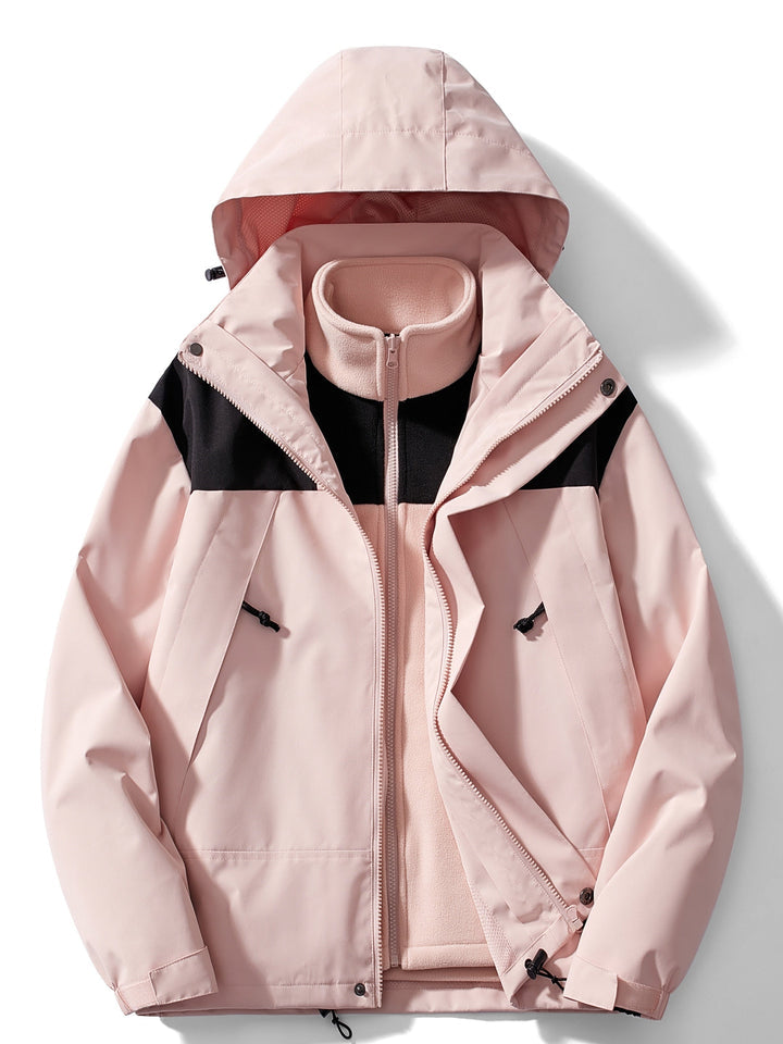 Version rose pâle de la veste à capuche avec empiècements noirs, doublure polaire rose zippée visible sous la veste ouverte. 6