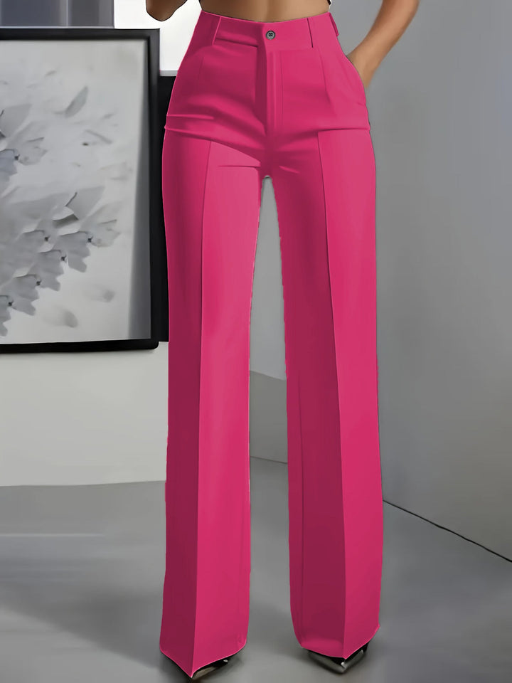 Pantalon large rose vif porté de face, avec pli repassé sur chaque jambe 4
