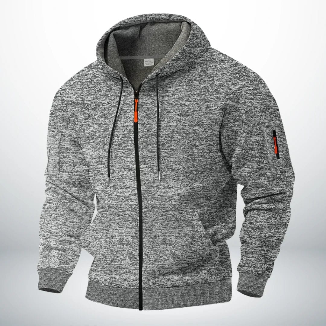 Sweat à capuche zippé en chiné gris clair, présenté de trois quarts, doublure grise visible dans la capuche et tirette orange. 3
