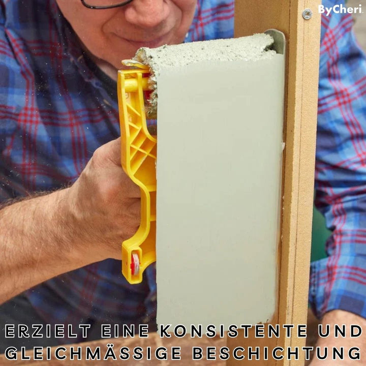 Homme à lunettes en chemise à carreaux peignant une planche en bois d'un vert grisé avec l'outil jaune, en plan rapproché. 9
