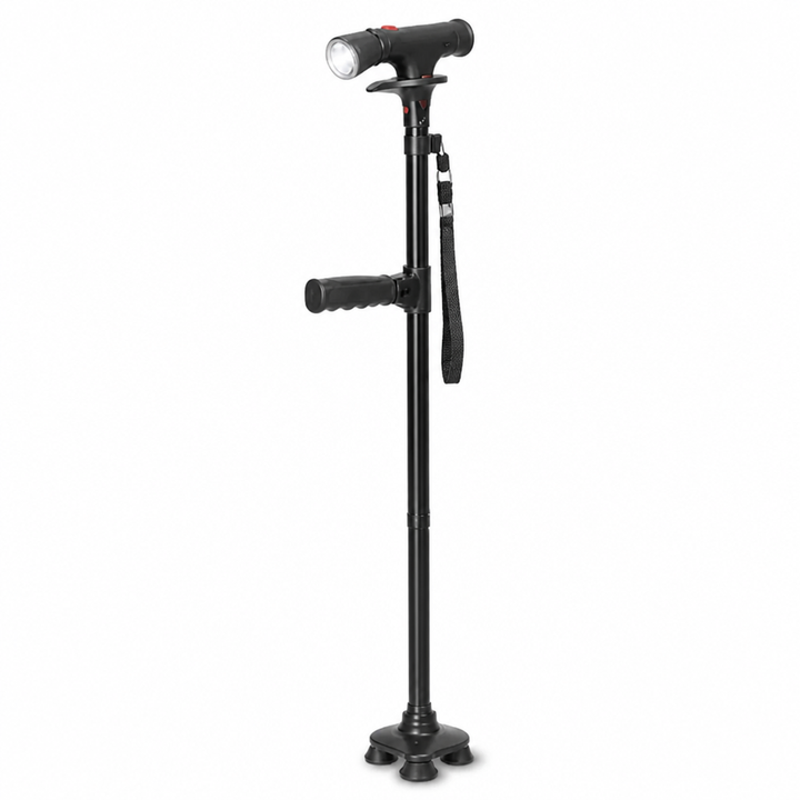 Canne noire vue de face sur fond blanc, avec poignée en T, lampe LED, deuxième poignée en mousse, dragonne et pied à quatre points. 5