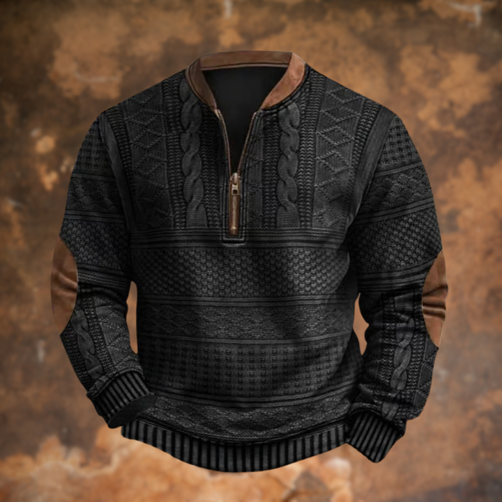 Version noire du pull demi-zip aux torsades, avec col, fermeture et coudières marron, présentée de face. 2
