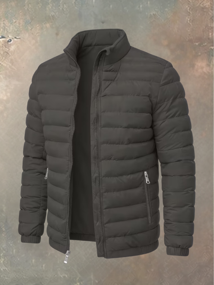 Veste matelassée gris foncé ouverte, vue de trois quarts, avec col montant et poches zippées 5