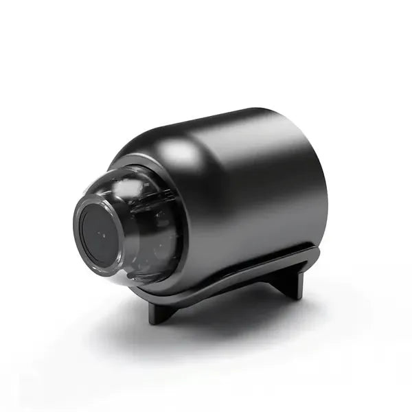 Caméra noire cylindrique vue de trois quarts avant, objectif visible, posée sur son petit support. 9