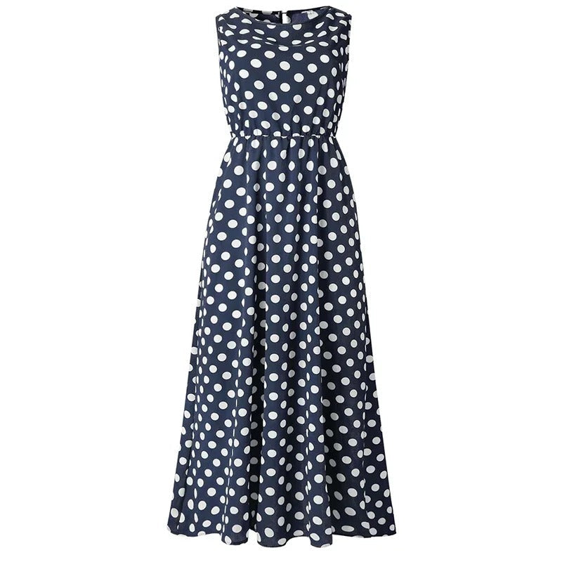 Robe longue bleu marine à pois blancs, vue de face à plat sur fond blanc, taille élastiquée et jupe évasée. 6