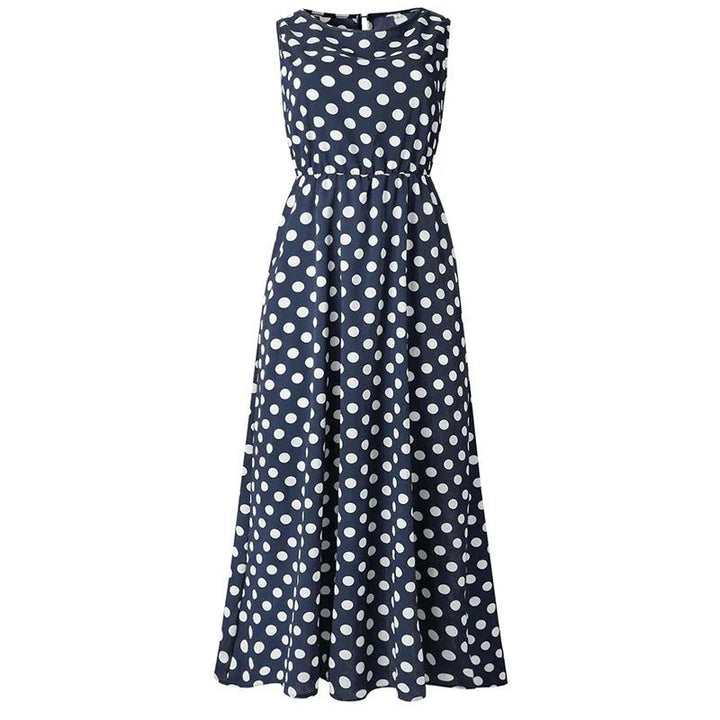 Robe longue bleu marine à pois blancs, vue de face à plat sur fond blanc, taille élastiquée et jupe évasée. 6