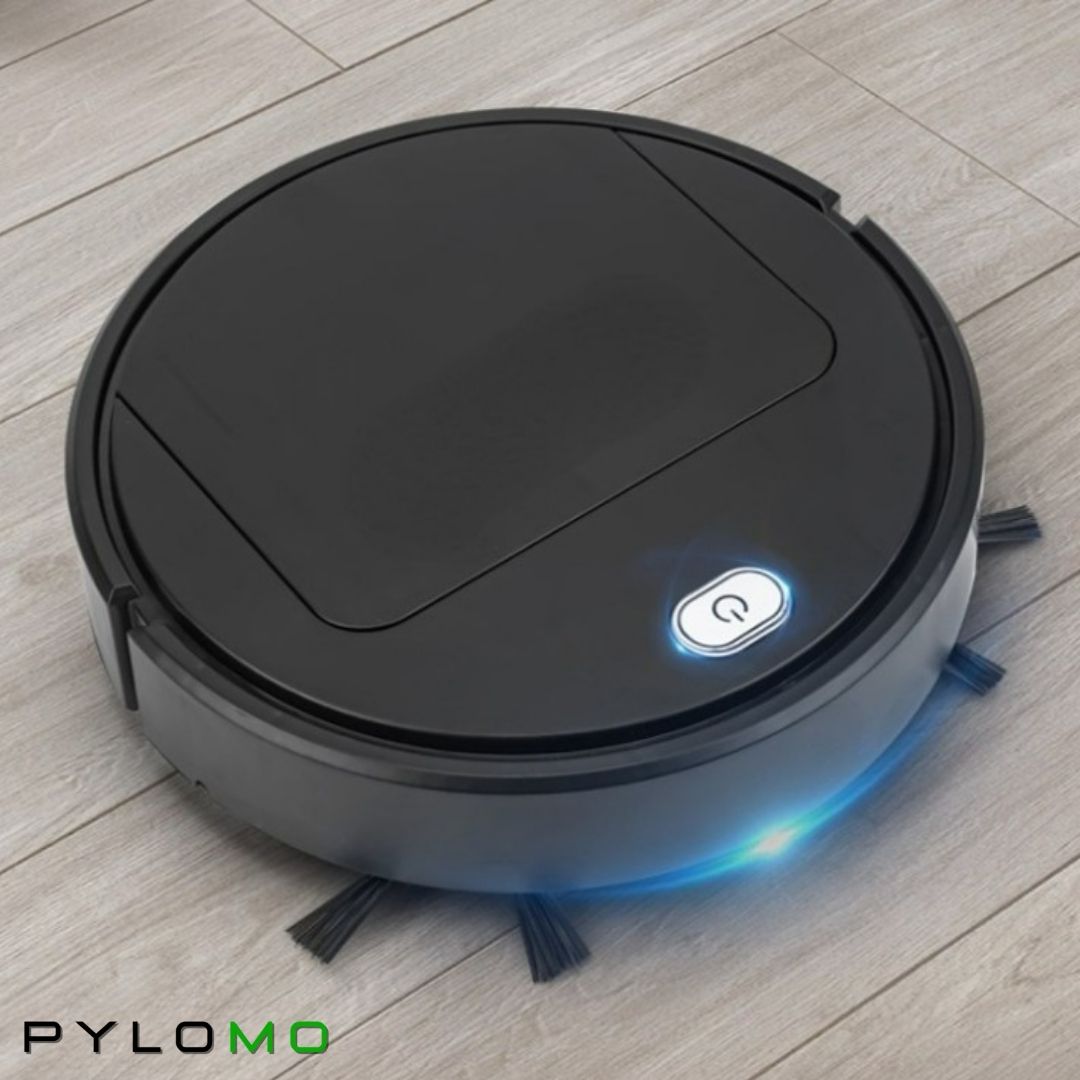 Robot noir en fonctionnement sur un parquet clair, voyant bleu lumineux autour du bouton et brosses latérales déployées. 4