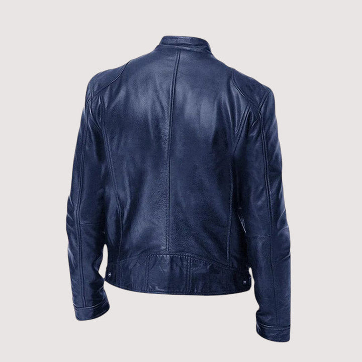 Veste bleu marine vue de dos, avec coutures verticales et bas resserré par des boutons-pression 5