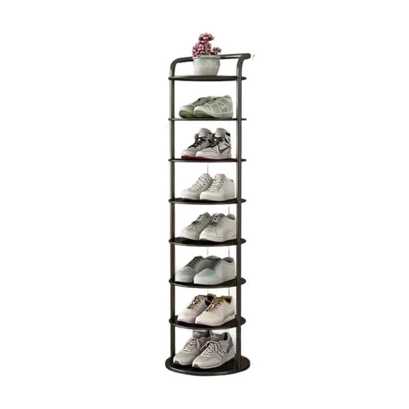 Étagère noire à huit niveaux sur fond blanc, remplie de baskets avec une plante en pot au sommet 17