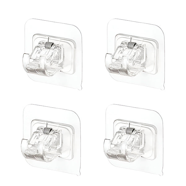 Quatre supports adhésifs transparents à pince et ressort, présentés de face sur fond blanc. 3