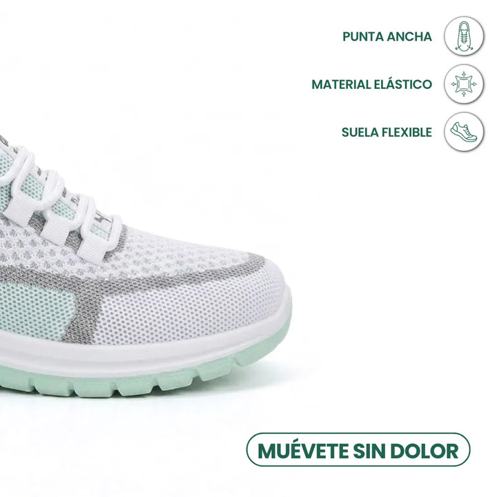 Gros plan sur l'avant de la basket vert menthe, avec icônes sur la pointe large, la matière élastique et la semelle flexible. 14