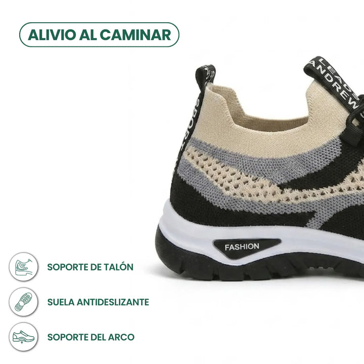 Gros plan sur le talon d'une basket en mesh beige, gris et noir, avec légende sur le maintien du talon et la semelle antidérapante. 40