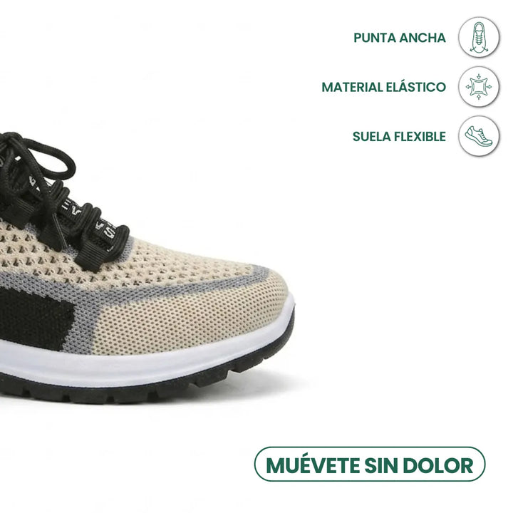 Gros plan sur le bout large d'une basket beige en mesh aéré, avec empiècements noirs et gris et semelle blanche. 41