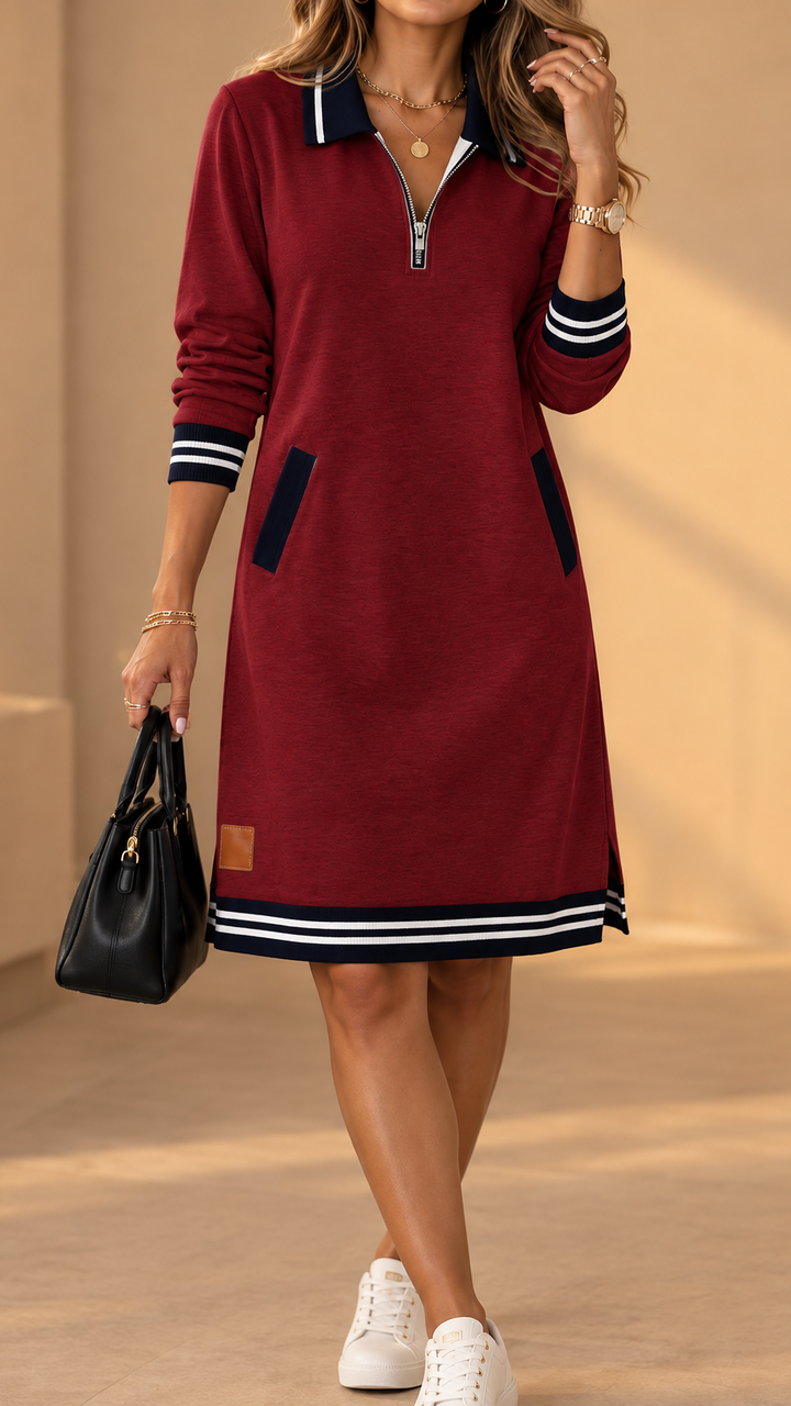 Même robe en bordeaux portée avec des baskets blanches, col marine zippé, bas rayé, petite étiquette en cuir au bas de la jupe. 3