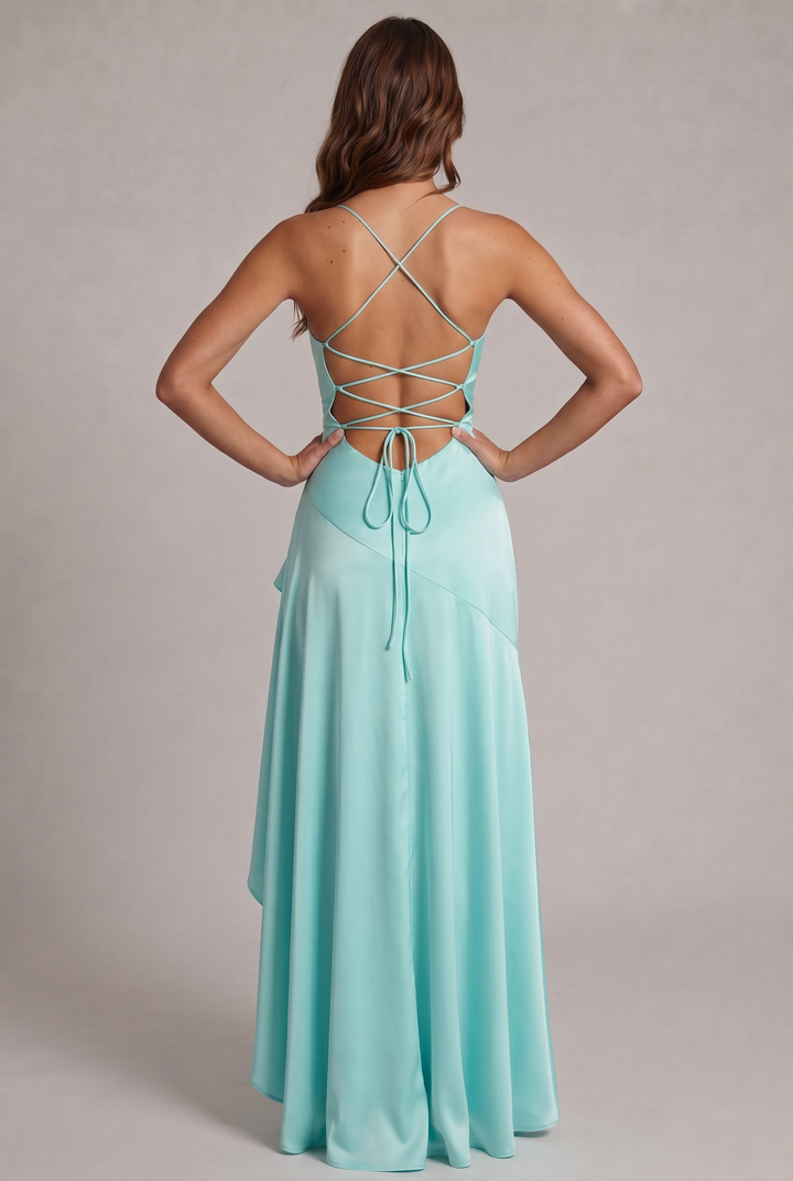 Dos de la robe turquoise : bretelles croisées, laçage dans le dos noué en boucles, fermeture zippée et jupe fluide. 24