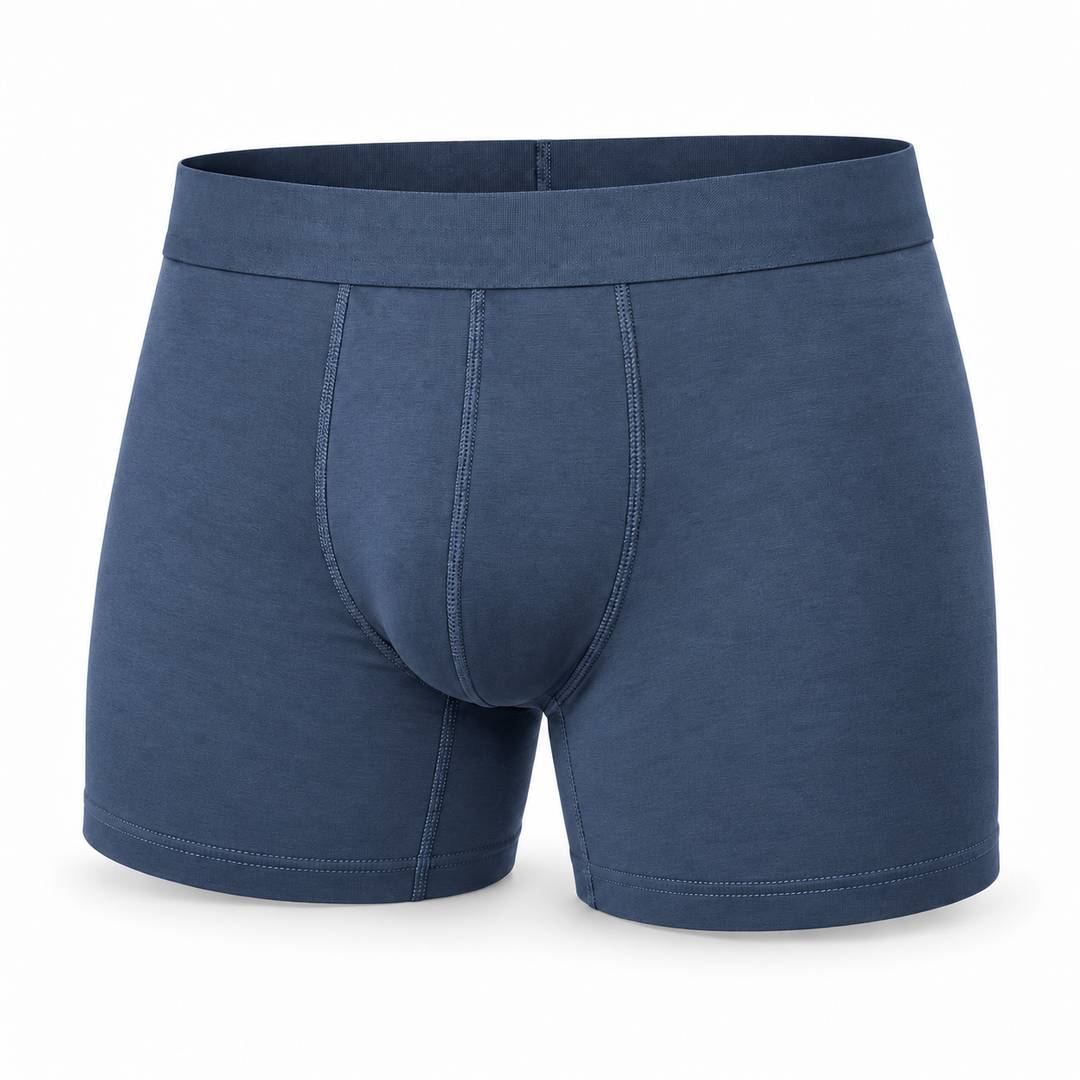 Boxer bleu denim seul, vue de face, avec ceinture élastique unie et coutures apparentes sur le devant. 9