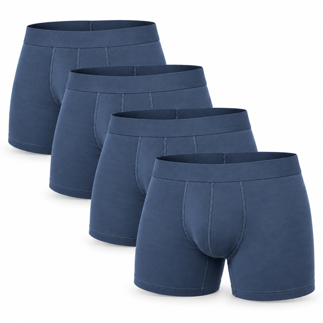 Lot de quatre boxers bleu denim présentés en cascade, ceintures élastiques unies et coutures de face visibles. 10