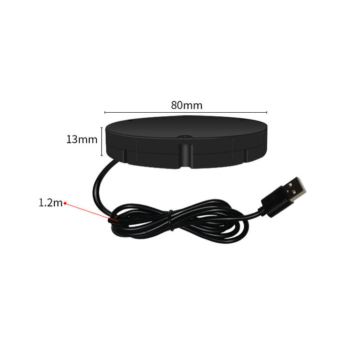 Chargeur noir rond avec son câble USB enroulé, accompagné des cotes de diamètre, d'épaisseur et de longueur du câble. 9