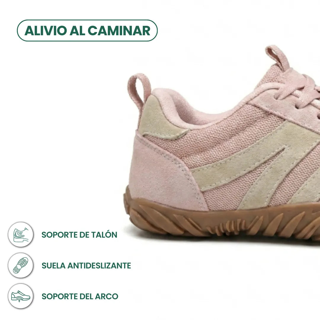 Gros plan sur le talon de la chaussure rose, avec pictogrammes sur le maintien du talon, la semelle et la voûte. 13