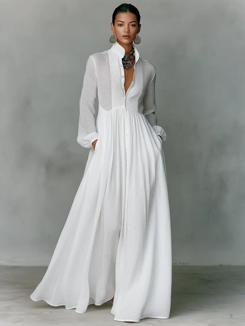 Robe maxi blanche en pied, vue de face, jupe évasée qui tombe jusqu'au sol 7