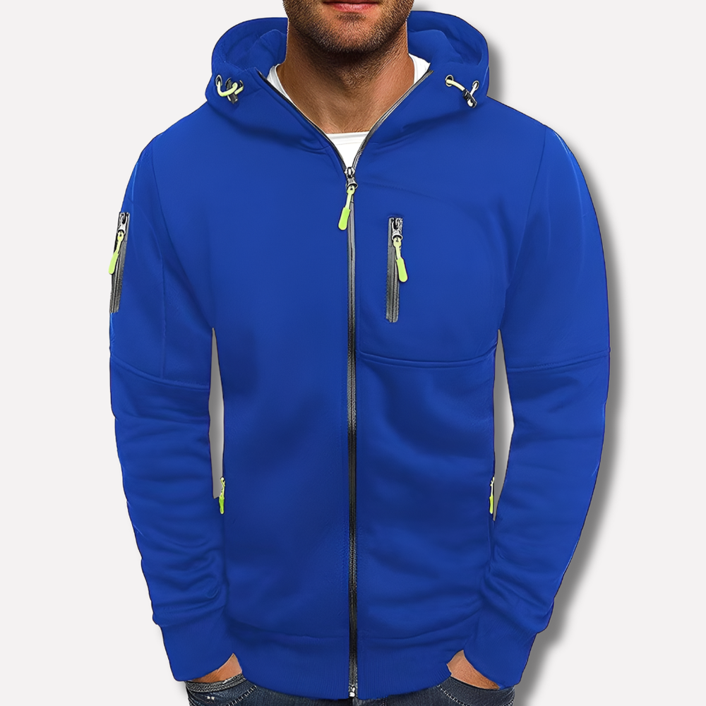 Sweat zippé bleu roi porté de face par un modèle sur fond clair, avec zips vert citron et poche sur la manche. 2