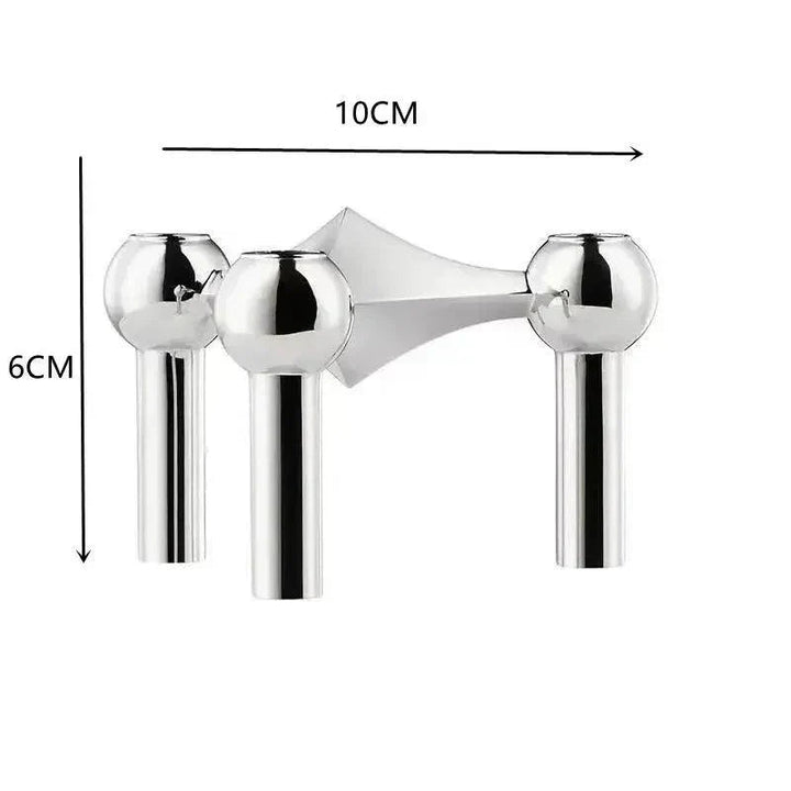 Module argenté à trois têtes sphériques sur fond blanc, avec flèches indiquant les dimensions de 10 cm de large et 6 cm de haut. 8