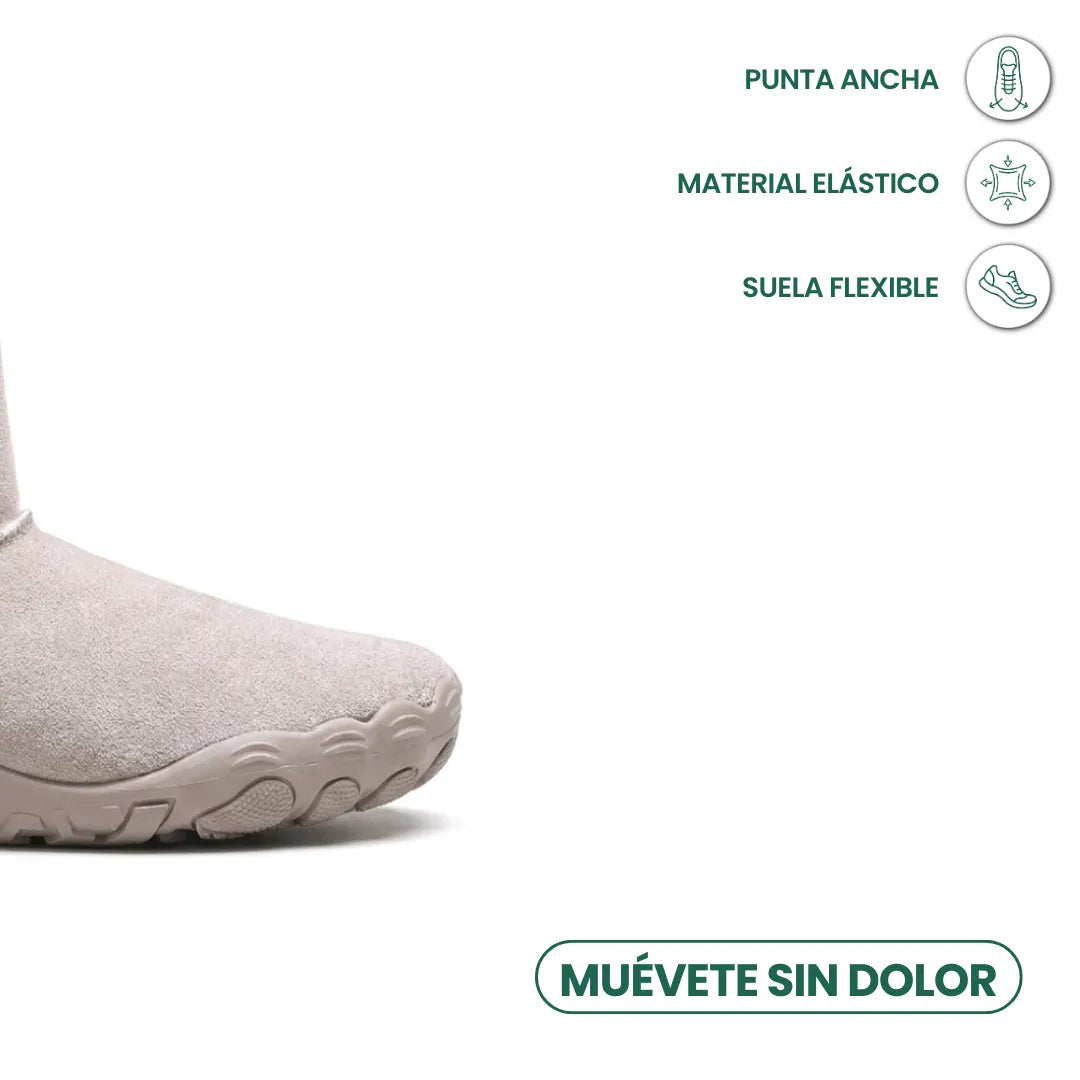 Bout large de la botte gris clair en daim, avec pictos sur la souplesse de la semelle 32