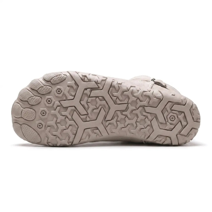 Dessous de la botte beige clair montrant la semelle à motifs hexagonaux antidérapants 36