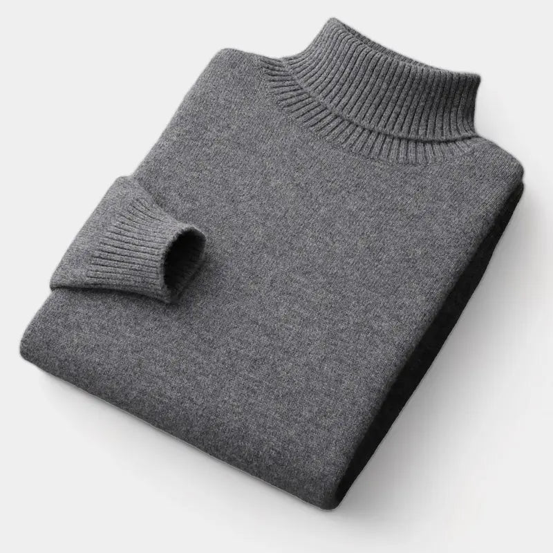 Pull à col roulé gris foncé plié à plat, manche repliée montrant le poignet côtelé 3