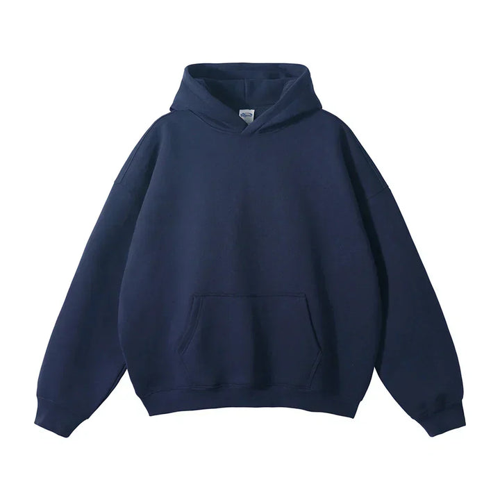 Face avant du sweat à capuche bleu marine, avec poche kangourou et poignets côtelés, présenté à plat sur fond blanc. 2