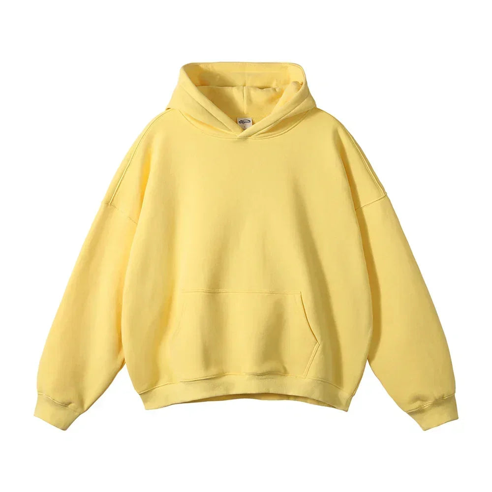 Face avant du sweat à capuche jaune pâle, avec poche kangourou et poignets côtelés, présenté à plat sur fond blanc. 19