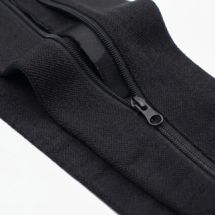 Gros plan sur la fermeture à glissière et le tricot du bas noir, doublure visible 12