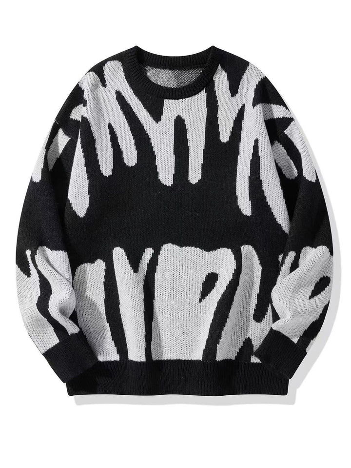 Pull en maille noir à grand motif abstrait blanc cassé, vu de face, à plat 2