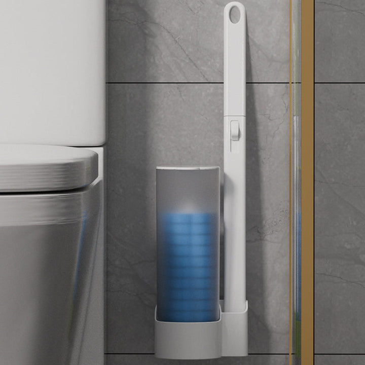 Manche blanc et distributeur de têtes bleues fixés au carrelage gris, à côté d'une cuvette de toilettes. 13