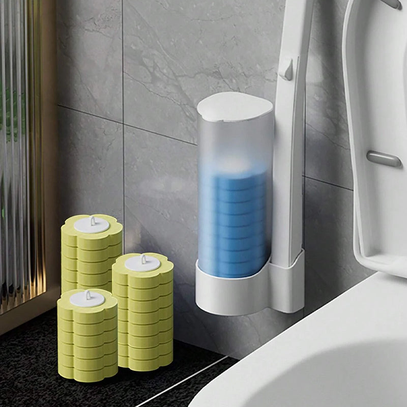 Distributeur mural de têtes bleues près du manche, avec trois piles de têtes jaunes de recharge posées au sol. 14