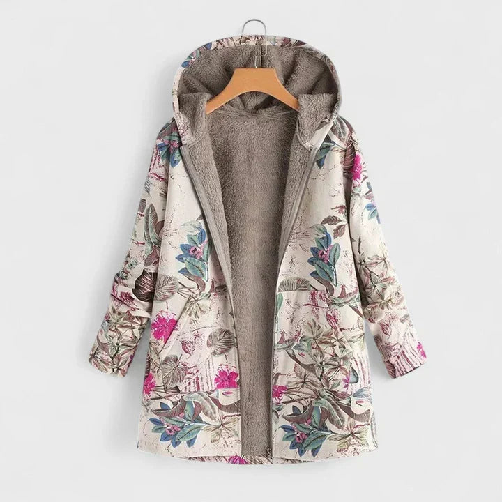 Parka doublée de peluche, fond clair, fleurs roses et feuilles bleu-vert, zip ouvert sur cintre 2