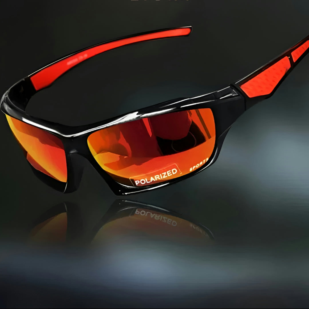 Vue de trois quarts des lunettes à verres miroir orange et branches rouges, sur fond sombre 6