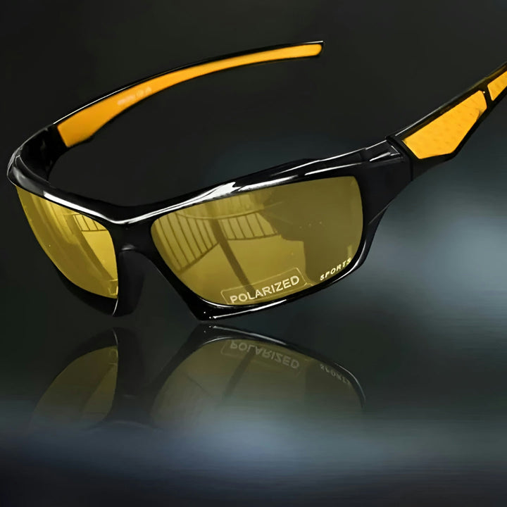Vue de trois quarts des lunettes à verres jaunes et branches orangées, sur fond sombre 9