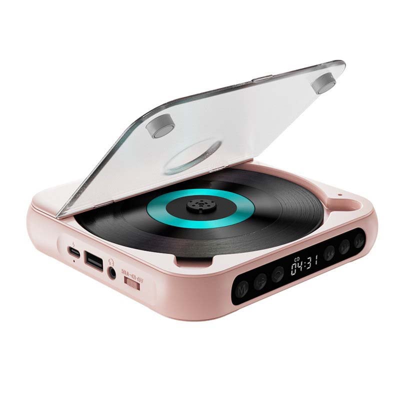 Lecteur rose couvercle transparent relevé, vu de trois quarts, avec disque à anneau turquoise, ports sur le côté et boutons de commande. 14