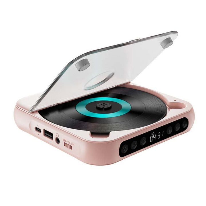 Lecteur rose couvercle transparent relevé, vu de trois quarts, avec disque à anneau turquoise, ports sur le côté et boutons de commande. 14