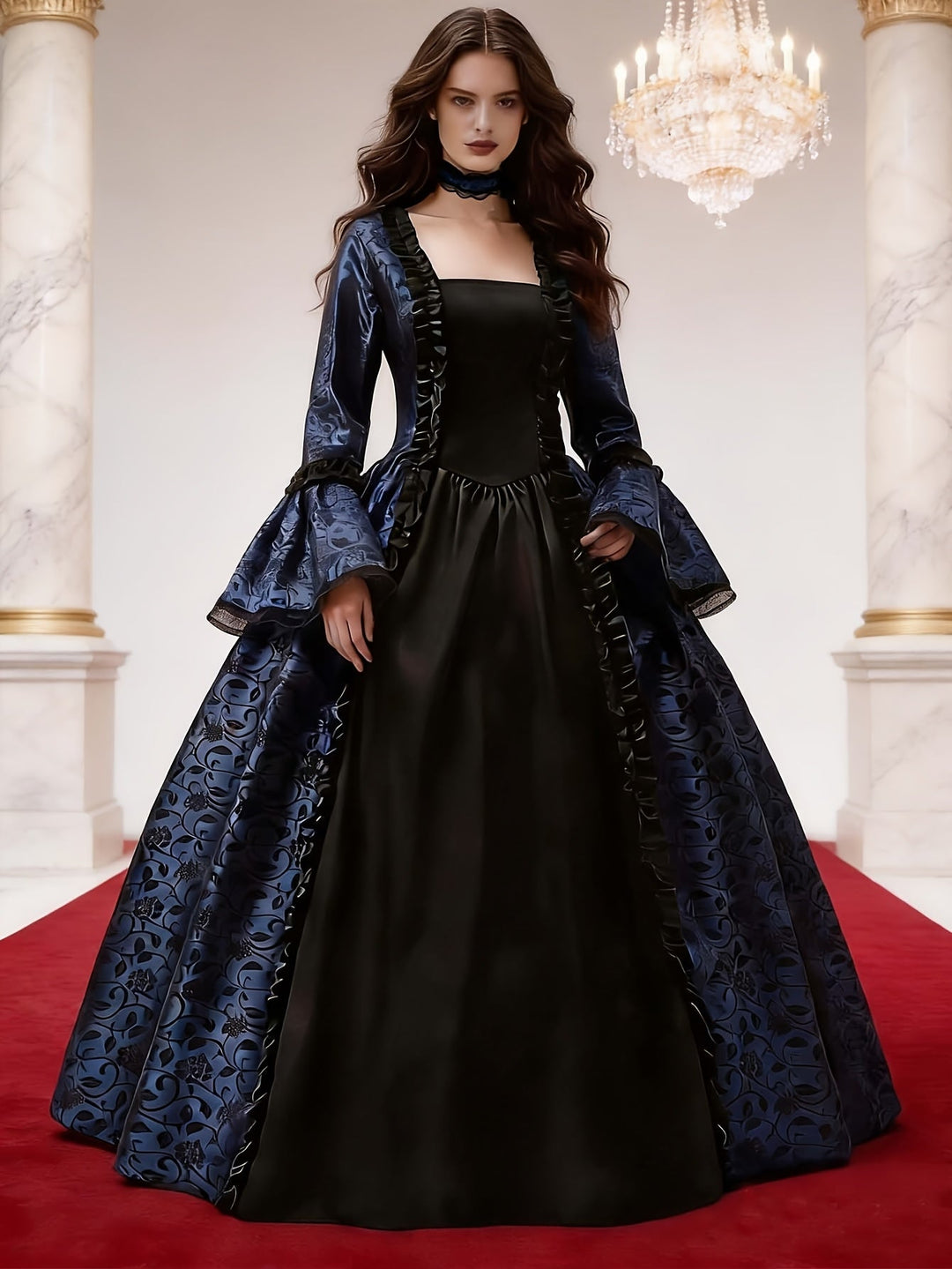 Robe bleu marine à motif floral et corsage noir porté par une femme dans un hall de marbre avec lustre. 2