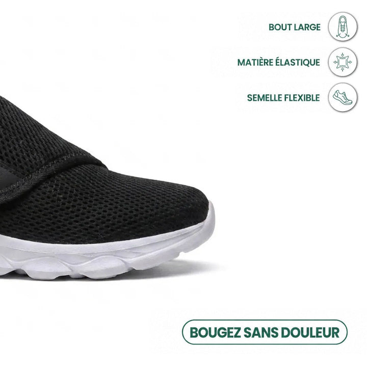 Gros plan sur la pointe large d'une chaussure noire en mesh à semelle blanche flexible, avec trois pictogrammes de confort. 23
