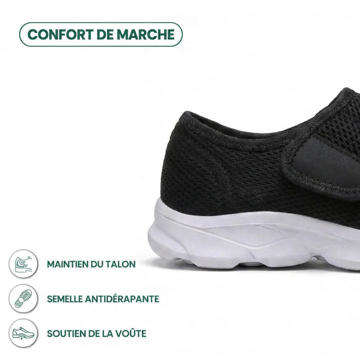 Détail du talon d'une chaussure noire en mesh avec semelle blanche, sangle auto-agrippante et pictogrammes sur le maintien du talon, l'adhérence et la voûte. 22