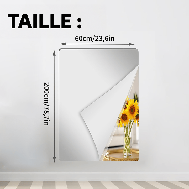 Grande feuille miroir large et très haute collée au mur, coin décollé sur un bouquet de tournesols, avec cotes de largeur et hauteur. 15