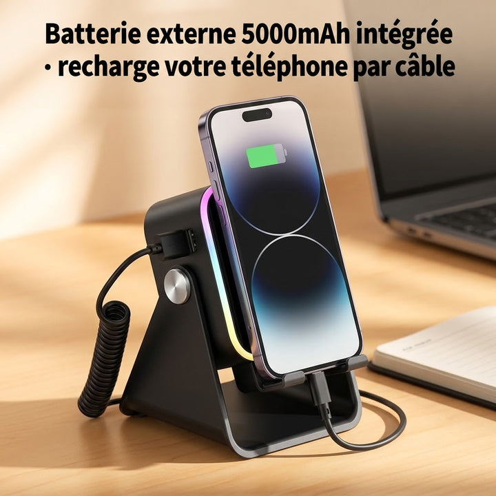 Téléphone en charge sur le support noir, relié par un câble spiralé, près d'un ordinateur portable 5